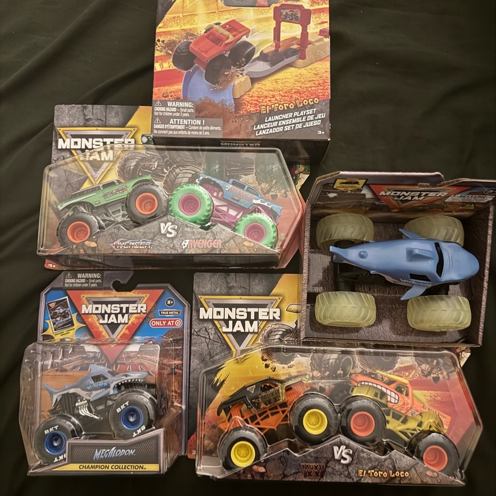 Monster Jam Toy Truck Set with Blue, Orange, and Green Vehicles